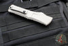 Microtech Combat Troodon Gen III OTF Knife- Double Edge- Natural Clear Handle- Apocalyptic Full Serrated Blade 1142-12 APNC Gen III 2024