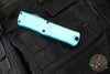 Microtech Combat Troodon Gen III OTF Knife- Double Edge- Turquoise Handle- Black Plain Edge Blade 1142-1 TQ Gen III