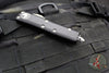 Microtech UTX-85 OTFKnife- Single Edge- Black Handle- Stonewash Part Serrated Blade 231-11
