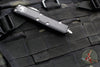 Microtech UTX-85 OTF Knife- Double Edge- Black Handle- Satin Full Serrated Blade 232-6