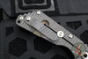 Mick Strider Custom SnG Folder- Drop Point- Nightmare Grind- SERRATED And Scalloped- Blackened Flats- Black Tire Tread G-10 And Flamed Titanium Handle