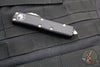 Microtech UTX-85 OTF Knife- Single Edge- Black Handle- Bronzed Part Serrated Blade 231-14