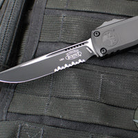 Microtech Ultratech ZBP Zero Blade Play OTF Knife- Single Edge- Tactical- Black Handle- Black Part Serrated Blade 1121-2 T