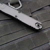 Microtech Ultratech ZBP Zero Blade Play OTF Knife- Single Edge- Tactical- Black Handle- Black Part Serrated Blade 1121-2 T