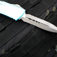 Microtech Combat Troodon Gen III OTF Knife- Double Edge- Turquoise Handle- Apocalyptic Part Serrated Blade 1142-11 APTQ Gen III 2024