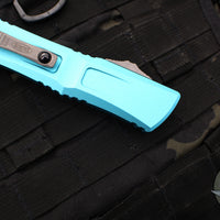 Microtech Combat Troodon Gen III OTF Knife- Double Edge- Turquoise Handle- Apocalyptic Part Serrated Blade 1142-11 APTQ Gen III 2024