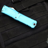 Microtech Combat Troodon Gen III OTF Knife- Double Edge- Turquoise Handle- Stonewash Part Serrated Blade 1142-11 TQ Gen III