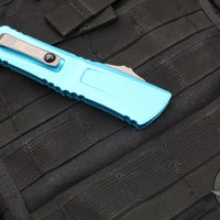 Microtech Combat Troodon Gen III OTF Knife- Double Edge- Turquoise Handle- Stonewash Full Serrated Blade 1142-12 TQ Gen III