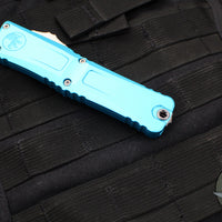 Microtech Combat Troodon Gen III OTF Knife- Double Edge- Turquoise Handle- Stonewash Full Serrated Blade 1142-12 TQ Gen III