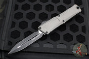 Microtech Combat Troodon Gen III OTF Knife- Double Edge- Natural Clear Finished Handle- Black Plain Edge Blade 1142-1 NC Gen III 2024