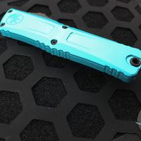 Microtech Combat Troodon Gen III OTF Knife- Double Edge- Turquoise Handle- Black Plain Edge Blade 1142-1 TQ Gen III