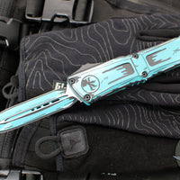 Microtech Combat Troodon Gen III OTF Knife- Double Edge- Turquoise Cel Shade Finished Handle- Turquoise Cel Shade Plain Edge Blade 1142-1 TQCOMICS GEN III