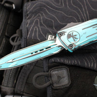 Microtech Combat Troodon Gen III OTF Knife- Double Edge- Turquoise Cel Shade Finished Handle- Turquoise Cel Shade Plain Edge Blade 1142-1 TQCOMICS GEN III