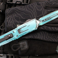 Microtech Combat Troodon Gen III OTF Knife- Double Edge- Turquoise Cel Shade Finished Handle- Turquoise Cel Shade Plain Edge Blade 1142-1 TQCOMICS GEN III