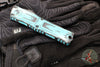 Microtech Combat Troodon Gen III OTF Knife- Double Edge- Turquoise Cel Shade Finished Handle- Turquoise Cel Shade Plain Edge Blade 1142-1 TQCOMICS GEN III