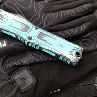 Microtech Combat Troodon Gen III OTF Knife- Double Edge- Turquoise Cel Shade Finished Handle- Turquoise Cel Shade Plain Edge Blade 1142-1 TQCOMICS GEN III