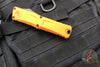 Microtech Combat Troodon Gen III OTF Knife- Double Edge- Orange Handle- Black Plain Edge Blade 1142-1 OR Gen III