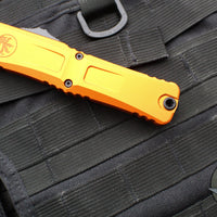 Microtech Combat Troodon Gen III OTF Knife- Double Edge- Orange Handle- Black Plain Edge Blade 1142-1 OR Gen III