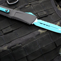 Microtech Combat Troodon Gen III OTF Knife- Double Edge- Black Handle- Turquoise Full Serrated Edge Blade 1142-3 TQSK Gen III 2024