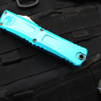 Microtech Combat Troodon Gen III OTF Knife- Single Edge- Turquoise Handle- Stonewash Part Serrated Blade 1143-11 TQ Gen III 2024