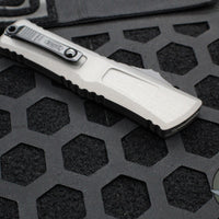 Microtech Combat Troodon Gen III OTF Knife- Single Edge- Natural Clear Finished Handle- Black Plain Edge Blade 1143-1 NC Gen III 2024