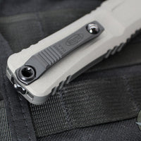 Microtech Combat Troodon Gen III OTF Knife- Tanto Edge- Natural Clear Finished Handle- Black Part Serrated Blade 1144-2 NC Gen III