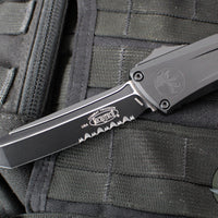 Microtech Combat Troodon Gen III OTF Knife- Tanto Edge- Tactical- Black Handle- Black Part Serrated Blade 1144-2 T Gen III