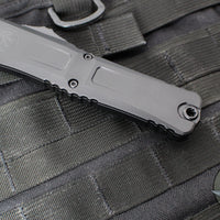 Microtech Combat Troodon Gen III OTF Knife- Tanto Edge- Tactical- Black Handle- Black Part Serrated Blade 1144-2 T Gen III