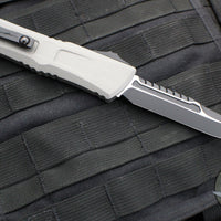 Microtech Combat Troodon Gen III OTF Knife- Interceptor Edge- Natural Clear Handle- Black Blade 1217-1 NCS