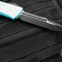 Microtech Combat Troodon Gen III OTF Knife- Interceptor Edge- Turquoise Handle- Black Blade 1217-1 TQS