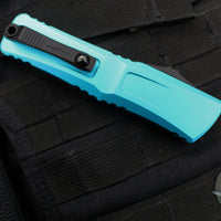 Microtech Combat Troodon Gen III OTF Knife- Interceptor Edge- Turquoise Handle- Black Blade 1217-1 TQS