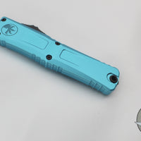 Microtech Combat Troodon Gen III OTF Knife- Interceptor Edge- Turquoise Handle- Black Part Serrated Blade 1217-2 TQS