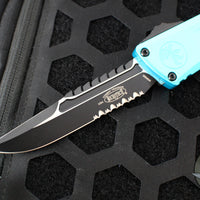 Microtech Combat Troodon Gen III OTF Knife- Interceptor Edge- Turquoise Handle- Black Part Serrated Blade 1217-2 TQS