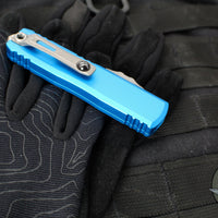 Microtech UTX-85 OTF Knife- GEN III- Double Edge- Blue Handle- Apocalyptic Full Serrated Blade 1232-12 APBL