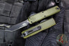 Microtech UTX-85 OTF Knife- GEN IV- Tanto Edge- OD Green Handle- Black Finished Part Serrated Blade 12334-2 OD