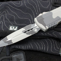 Microtech Luminary OTF Knife- Urban Camo Finished Handle- Urban Camo Finished Plain Edge Blade- Tritium Inlaid Button 1270-1 UCS