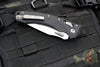 Microtech Knives- Amphibian Ram-Lok Folder- Fluted Black G-10 Handle- Stonewash Plain Edge Blade 137RL-10 FLGTBK
