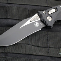 Microtech Knives- Amphibian Ram-Lok Folder- Fluted Black Aluminum Handle- Black Finished Blade 137RL-1 FL