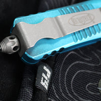Microtech Combat Troodon OTF Knife- Double Edge- Weathered Turquoise Handle- Apocalyptic Blade 142-10 APWTQ