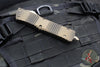 Microtech Combat Troodon OTF Knife- Signature Series- Double Edge- Antique Bronze Finished Handle- Bronze Over Damascus Blade- Low Polished HW 142-16 BZABLPS