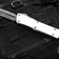 Microtech Combat Troodon OTF Knife- Signature Series- Double Edge- Clear Anodized Smooth Body Handle- Damascus Blade 142S-16 LPCRS