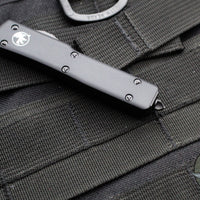 Microtech UTX-70 OTF Knife- Tactical- Tanto Edge- Black Handle- Black Part Serrated Blade 149-2 T V3