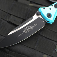 Microtech Socom Elite- Manual Folder- Single Edge- Turquoise Handle- Two-tone Black Blade 160-1 TQ