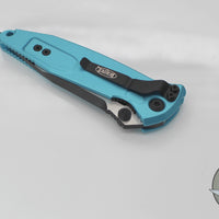 Microtech Socom Elite- Manual Folder- Single Edge- Turquoise Handle- Two-tone Black Blade 160-1 TQ