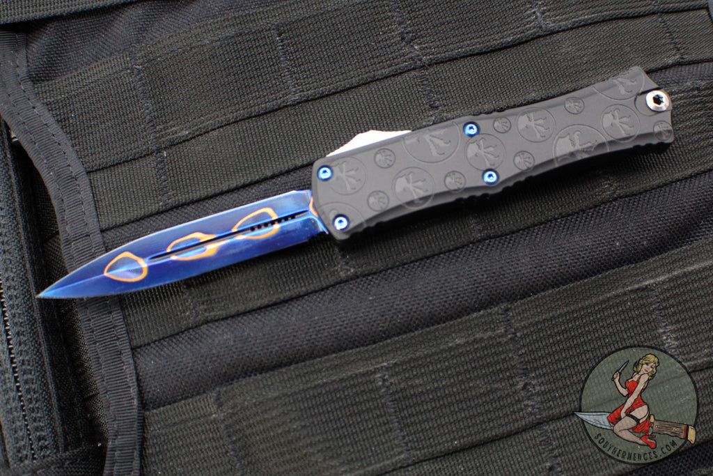 Microtech Hera II OTF Knife- MINI- Double Edge- Black Deep Logo Burst Handle- Blued Baker Forge Coppermai Damascus Blade- Blue HW 1702M-16 MS3