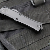 Microtech Hera II OTF Knife- MINI- Single Edge- Tactical- Black Handle- Black Part Serrated Blade 1703M-2 T