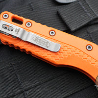 Microtech Knives- M.S.I. Ram-Lok Folder- Orange Tri-Grip Injection Molded Handle- Apocalyptic Plain Edge Blade 210T-10 APPMOR