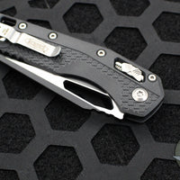 Microtech Knives- M.S.I. Ram-Lok Folder- Black Tri-Grip Injection Molded Handle- Black Part Serrated Edge Blade- Bead Blast Hardware 210T-2 PMBK