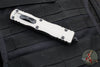 Microtech Dirac Delta OTF Knife- Double Edge- Titanium Gray Handle- Black Full Serrated Blade and Black HW 227-3 TG