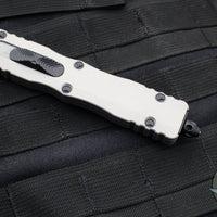 Microtech Dirac Delta OTF Knife- Double Edge- Titanium Gray Handle- Black Full Serrated Blade and Black HW 227-3 TG